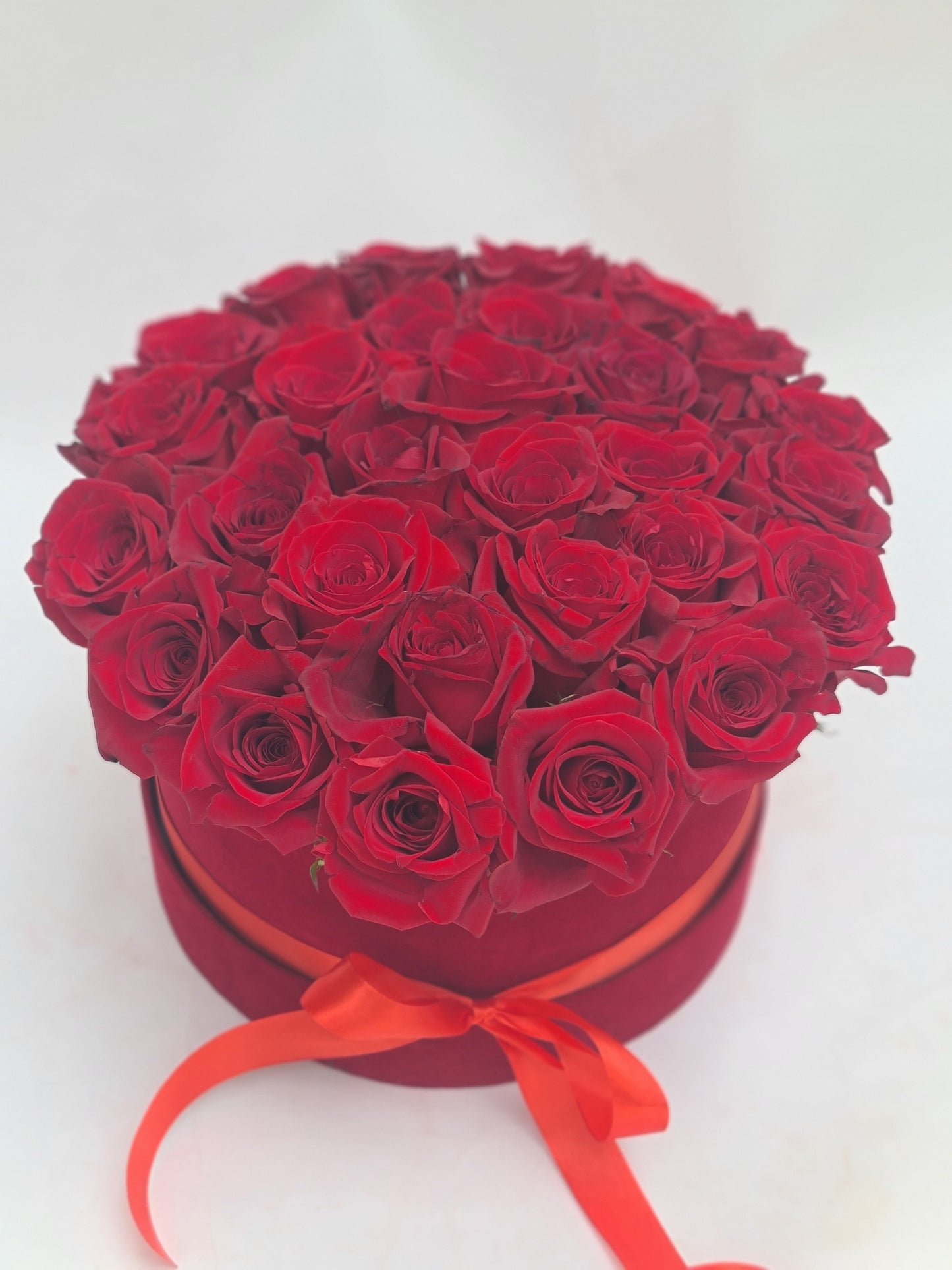 BOX OF ROUND RED ROSES